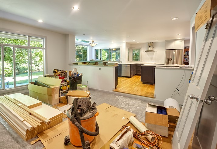 A home during a major renovation with the whole floor torn up.
