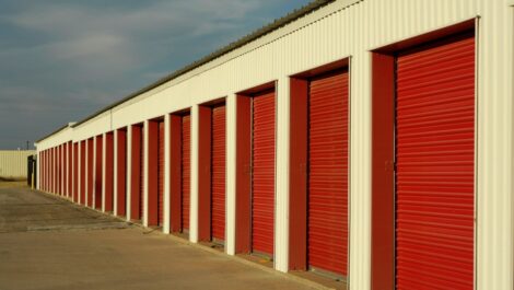 A row of self storage units at a drive-up storage facility.