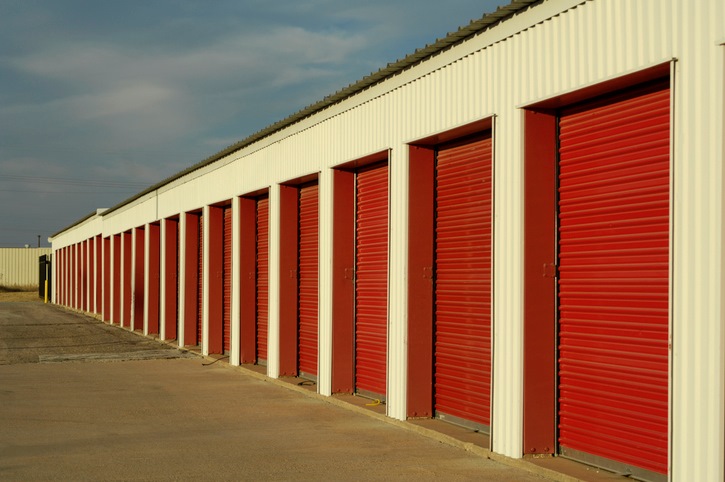 A row of self storage units at a drive-up storage facility.